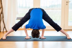 Wide-Legged Forward Bend (Prasarita Padottanasana): How to Do, Variations, & Benefits