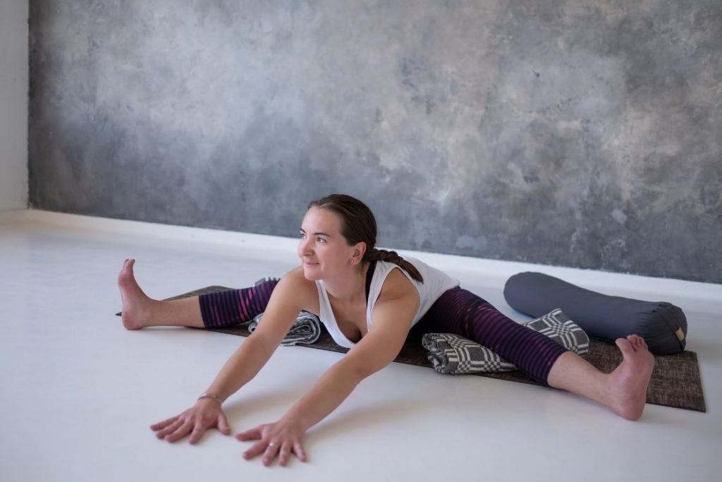 Upavistha Konasana modification with bolster