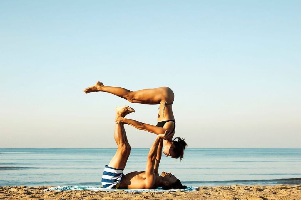 Folded Leaf Pose Acro Yoga