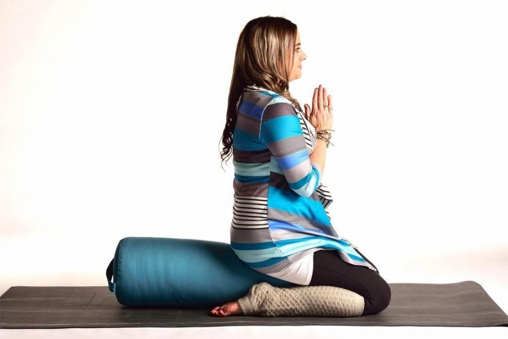 3 Easy Relaxation Yoga Poses With a Bolster