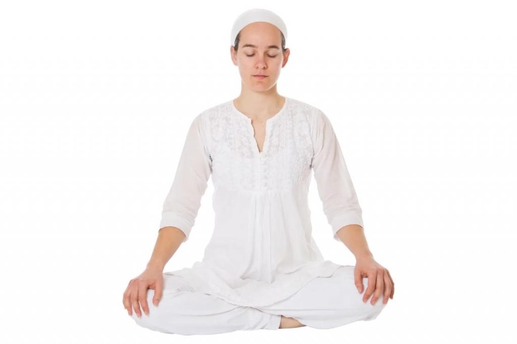 kundalini meditation hands down on knees